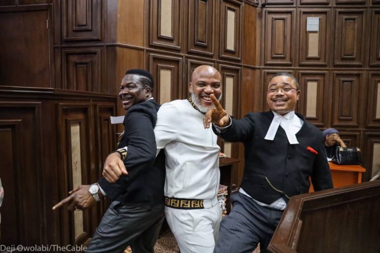 Despite bail denial, Nnamdi Kanu strikes friendly pose with lawyers in court with same Fendi dress (Photos)